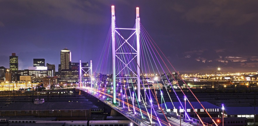 Multicolored lighting on Nelson Mandela Bridge in Johannesburg city.